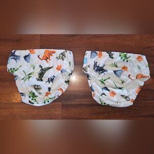 (2) Charlie Banana Reusable Swim Diapers with Orange, Green & Blue Dinosaurs